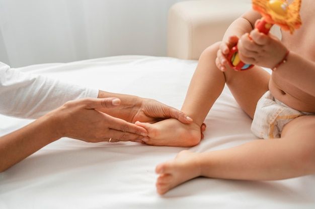 Baby recovering from growth plate injury with a leg cast